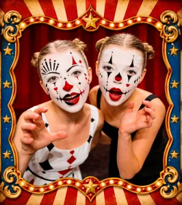 Two children with colourful circus clown face painting at a kids' party in Bristol.
